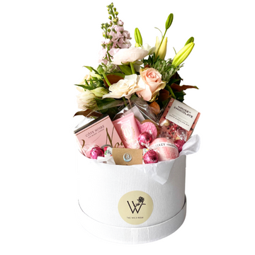 Spoil Her with a Floral and Pampering Gift Box. Celebration Box and The Wild Rose Florist. Delivery Auckland Wide.